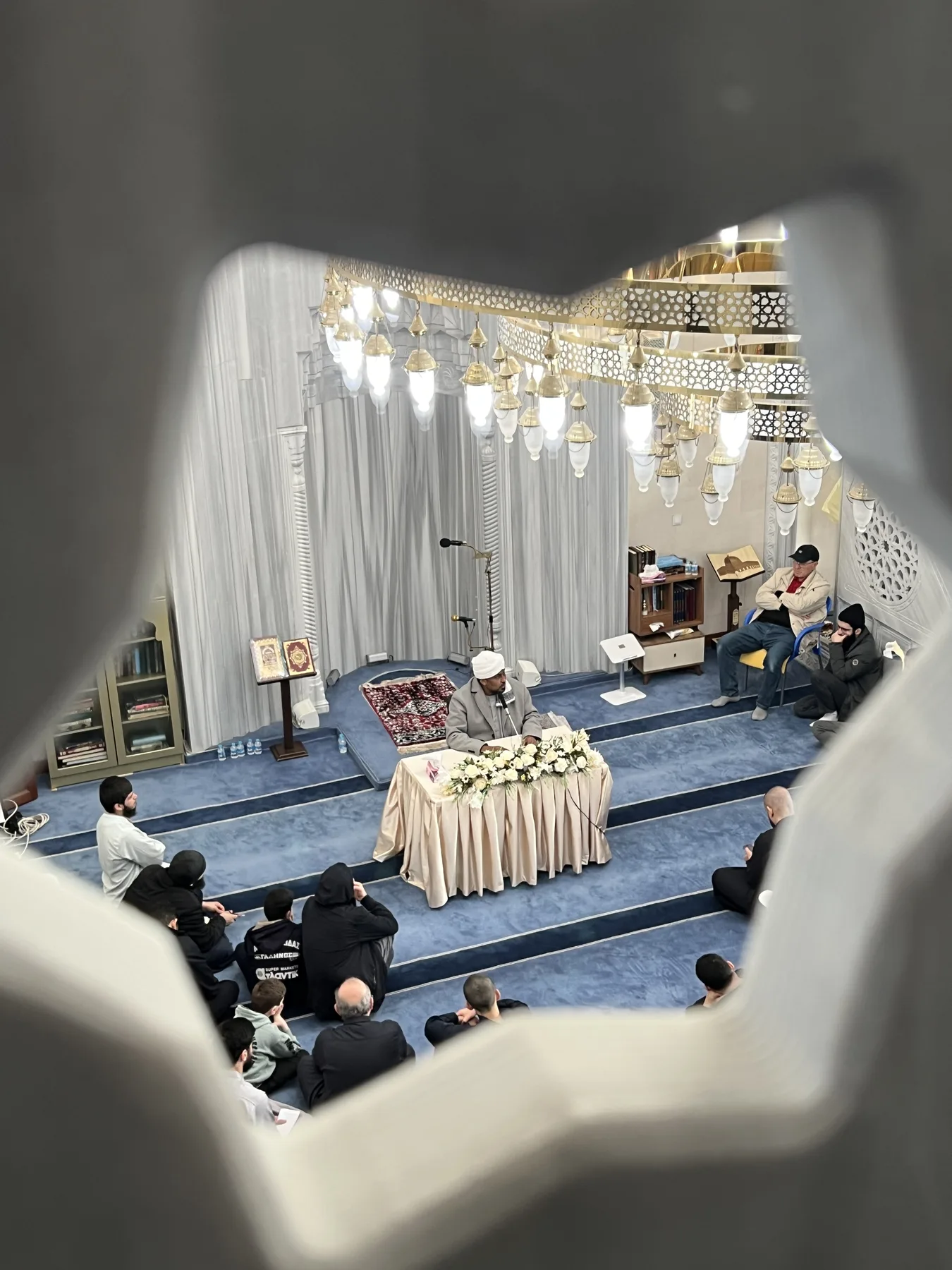 The upper gallery opens when the main floor fills: Fridays, Eid, and the last ten nights of Ramadan.